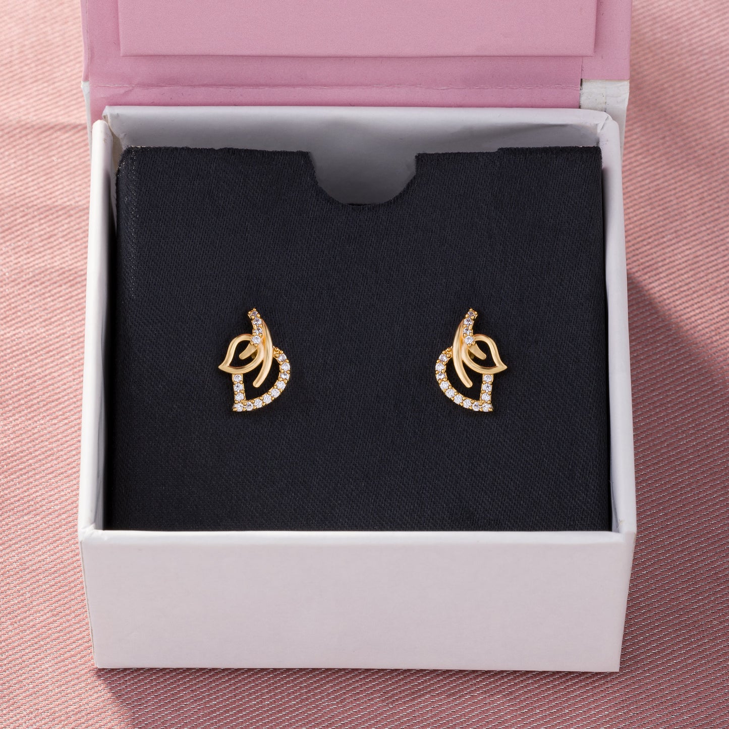 pair of golden earrings with diamonds