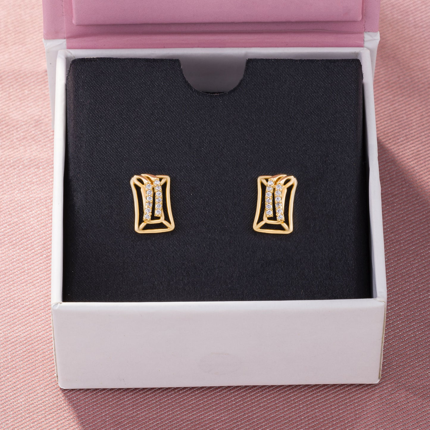 pair of golden earrings with diamonds