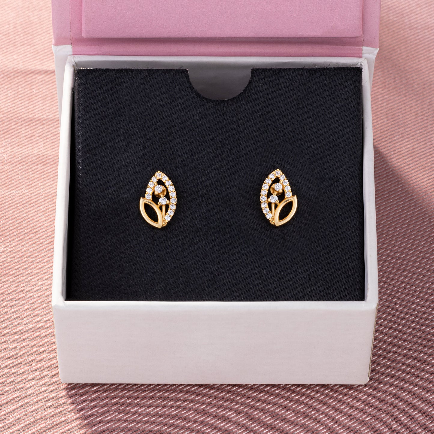 pair of golden earrings with diamonds