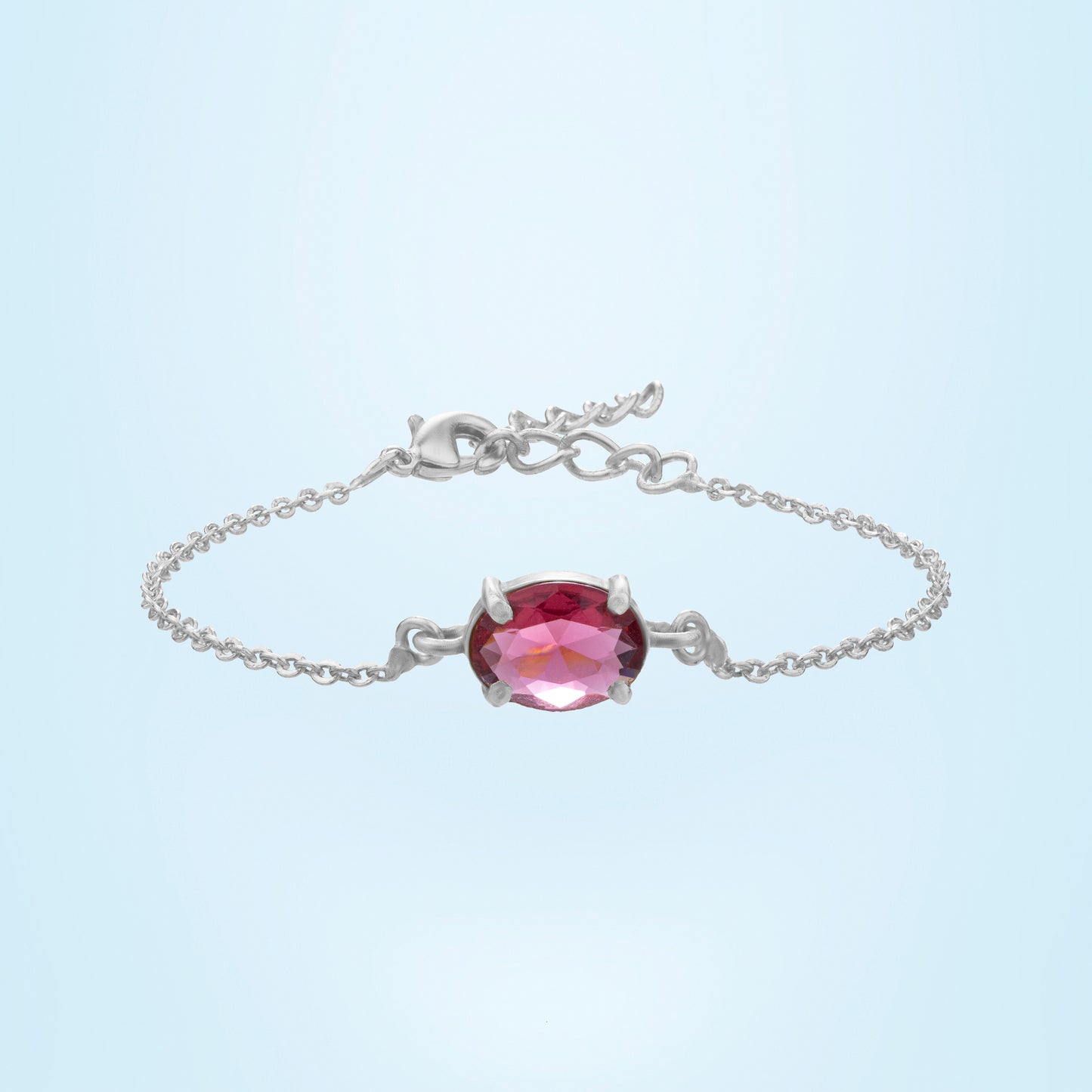 silver bracelet with a red stone