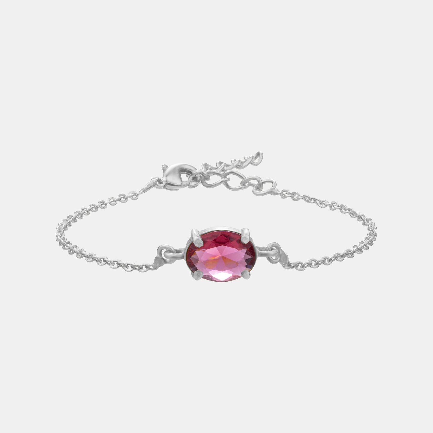 silver bracelet with a red stone