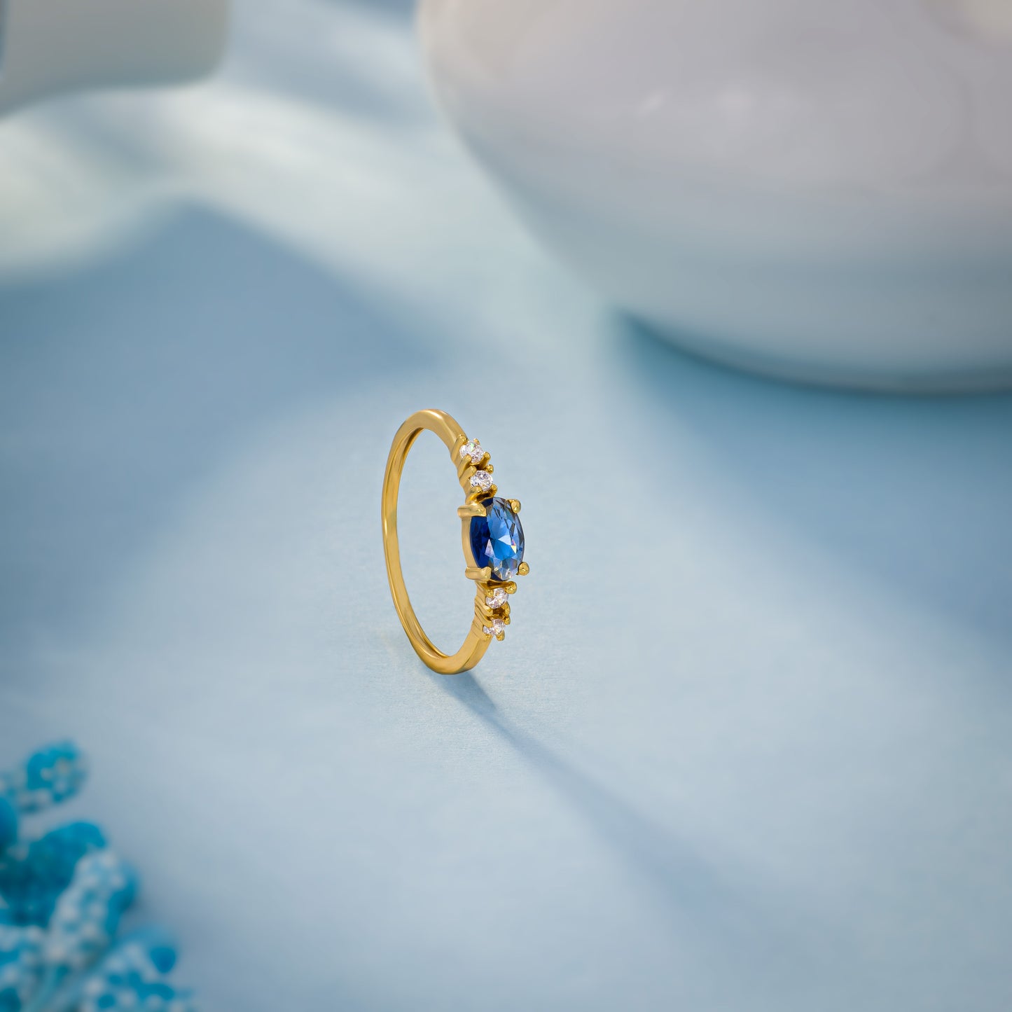 golden ring with a sapphire and diamonds