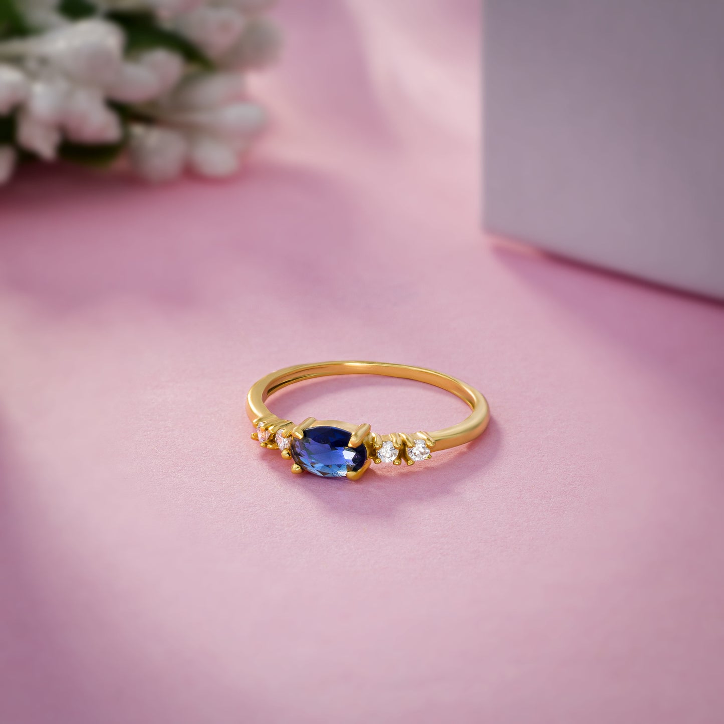 golden ring with a sapphire and diamonds