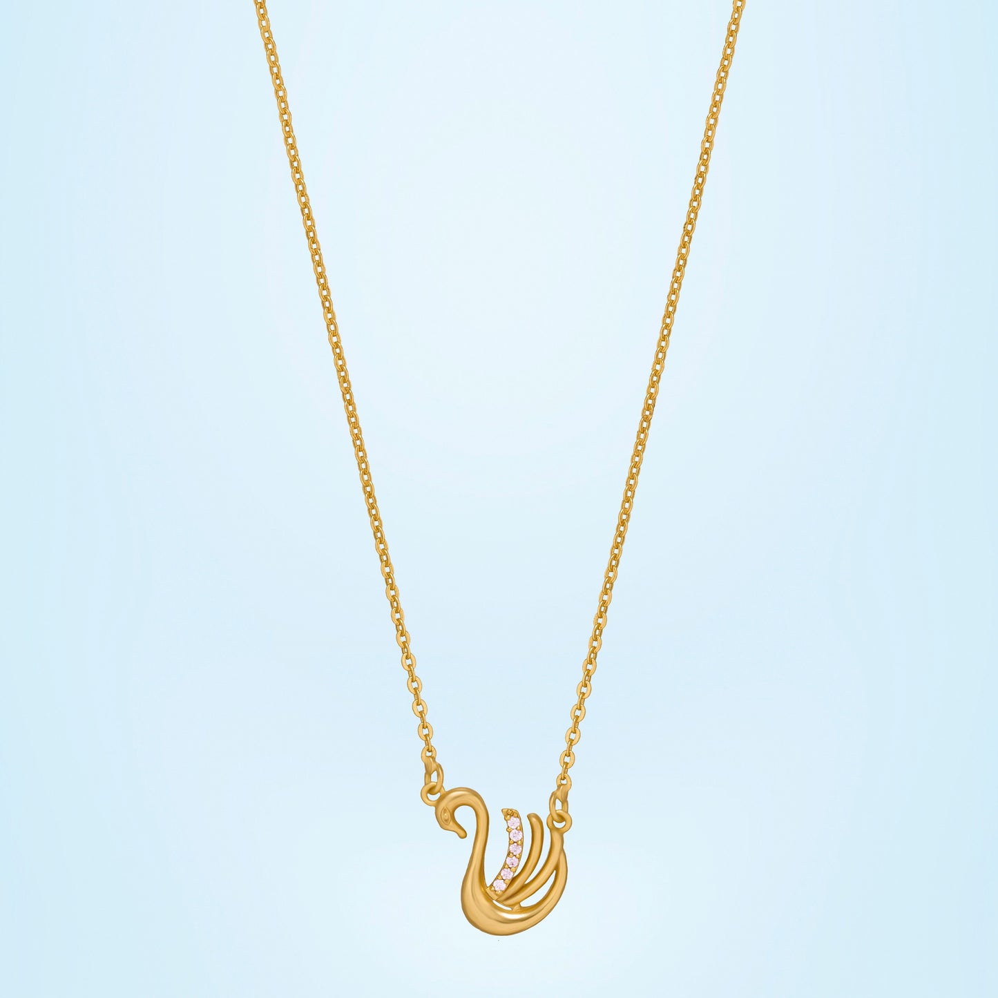 golden necklace with a bird on it