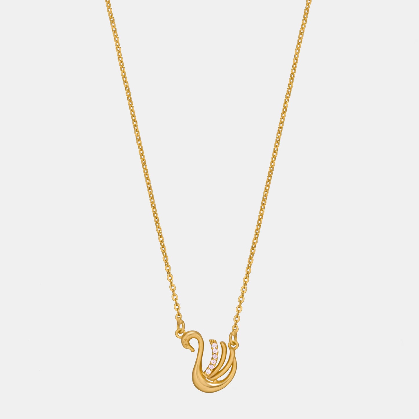 golden necklace with a bird on it