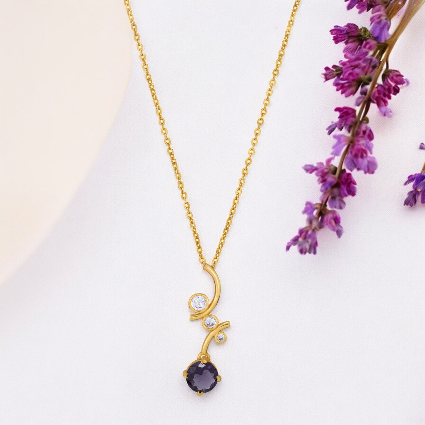 golden necklace with a stone and diamond