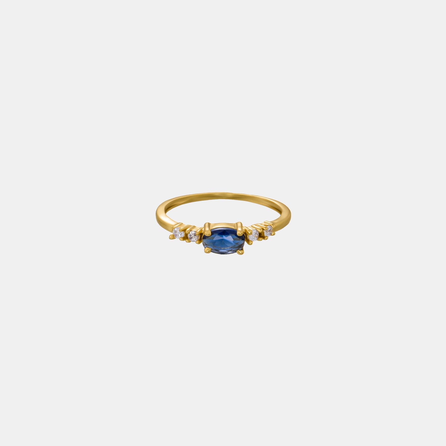 golden ring with a sapphire and diamonds