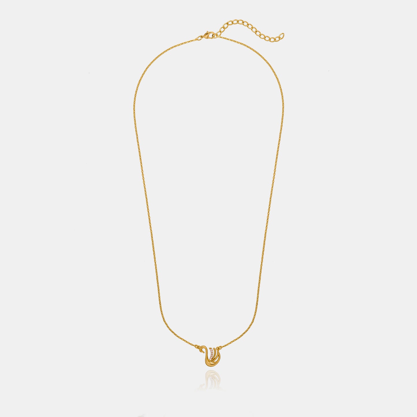 golden necklace with a bird on it