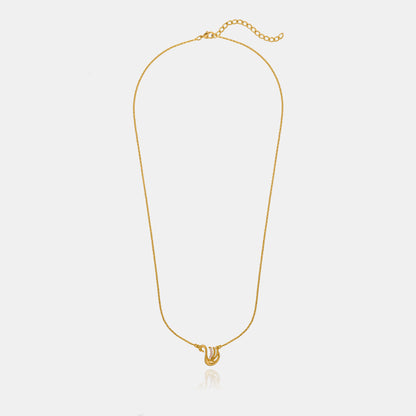 Golden Necklace with a Bird on it