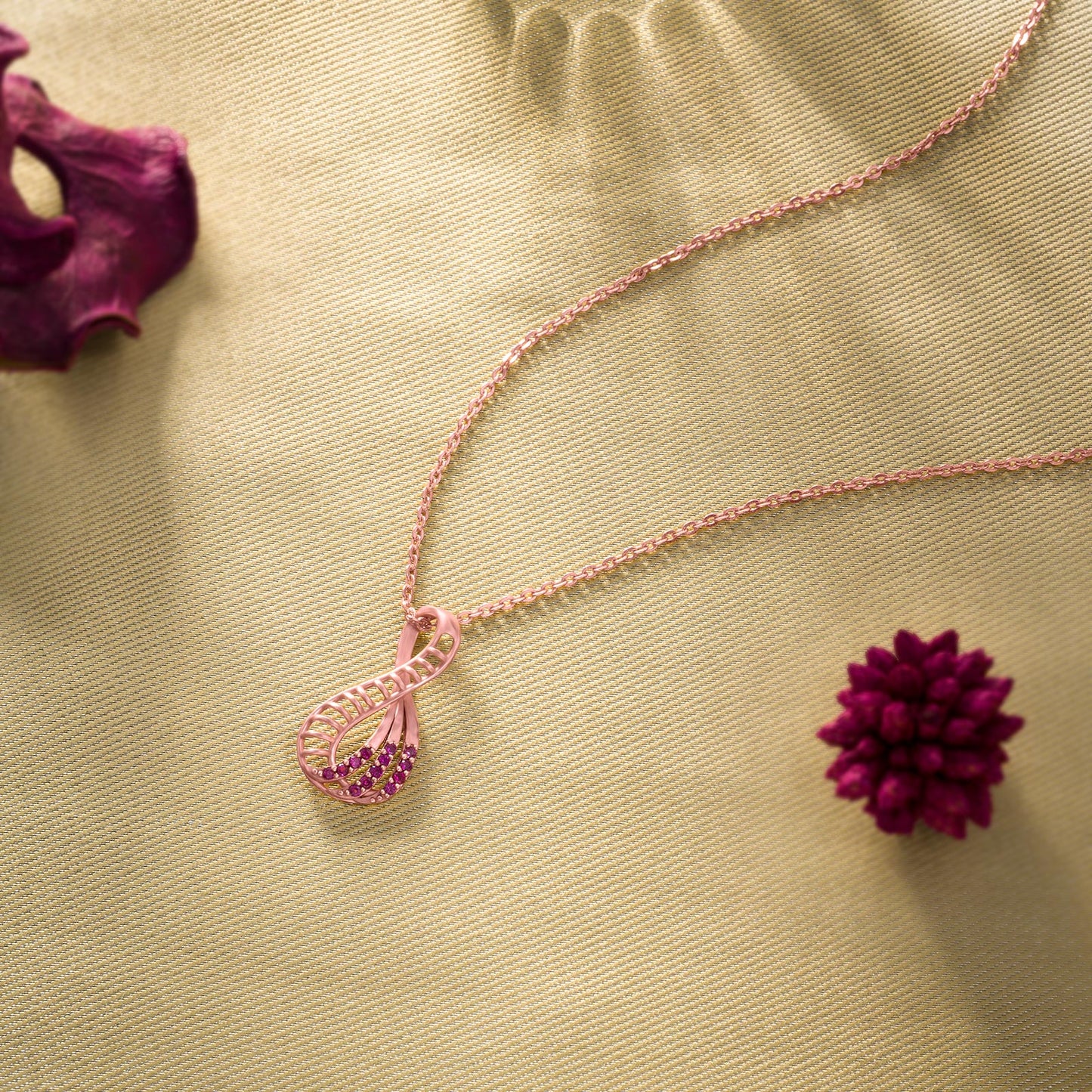 pink pendant with a rose gold necklace