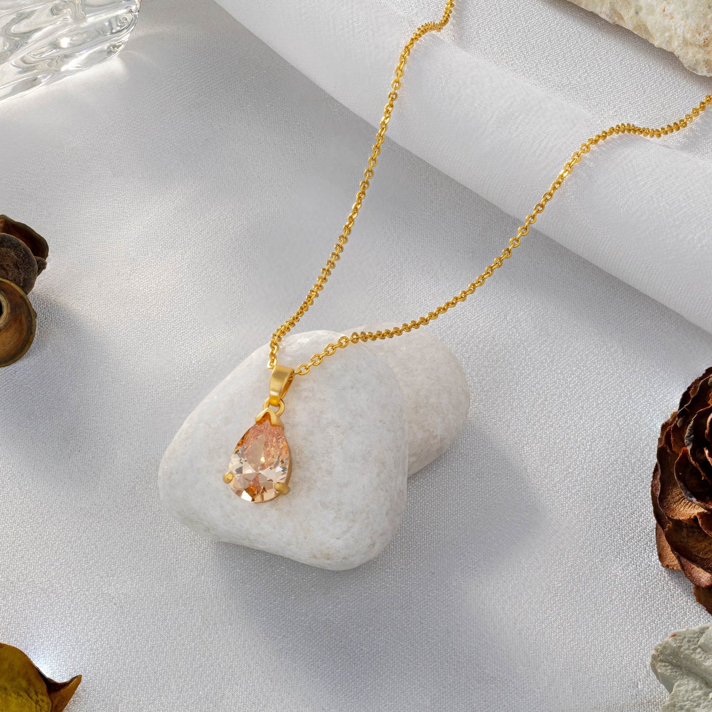 golden necklace with a small stone