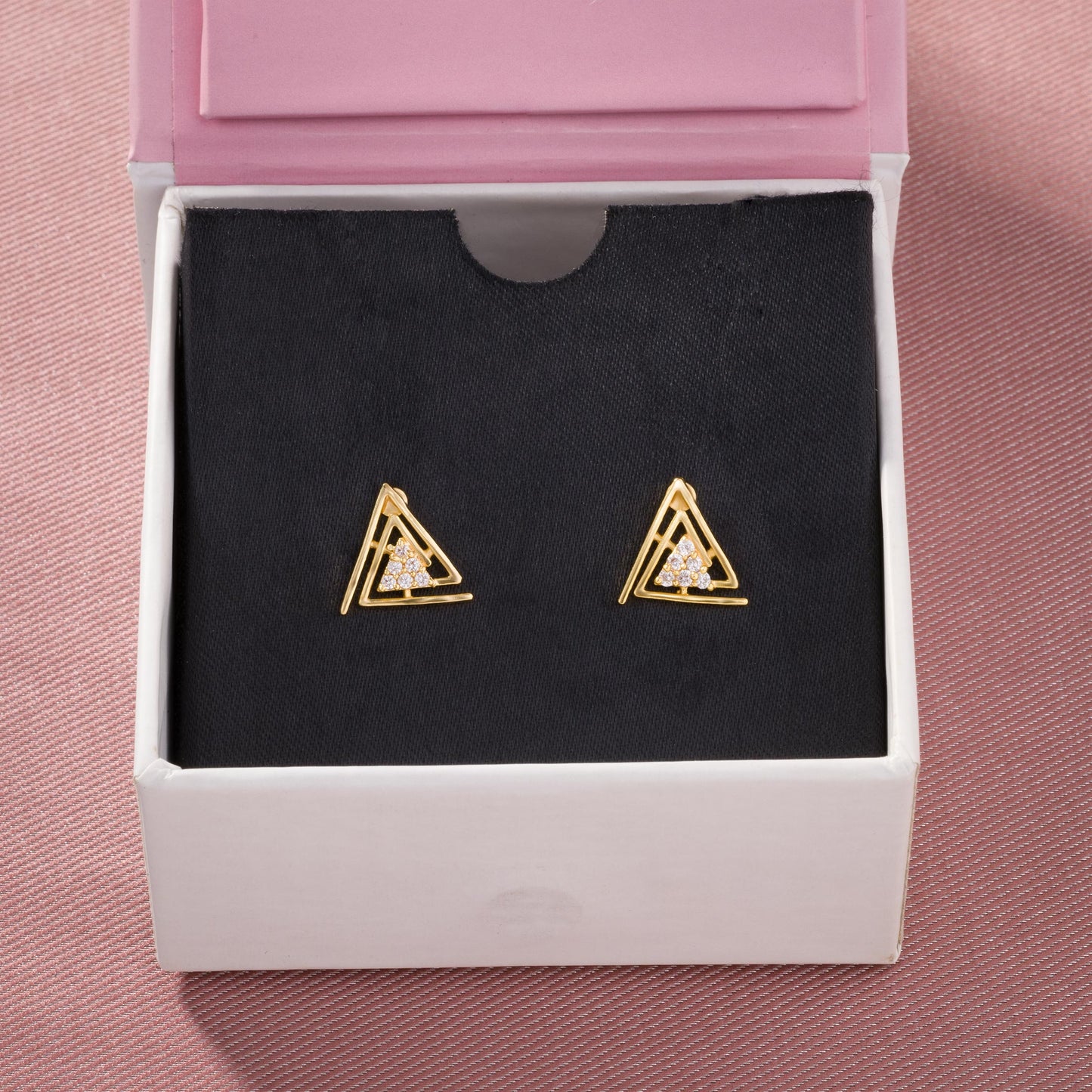 pair of golden earrings with diamonds