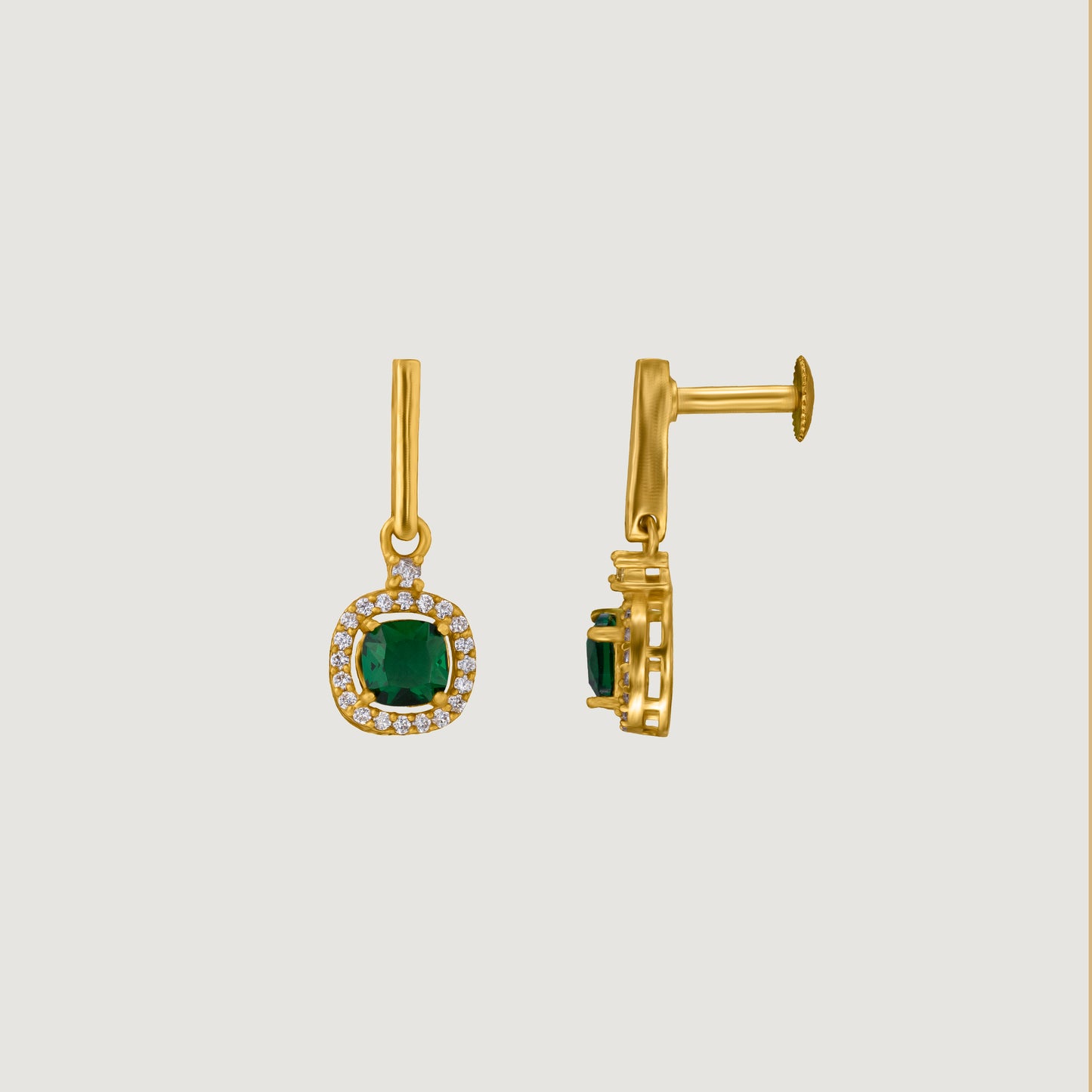 pair of earrings with a ruby stone and diamonds