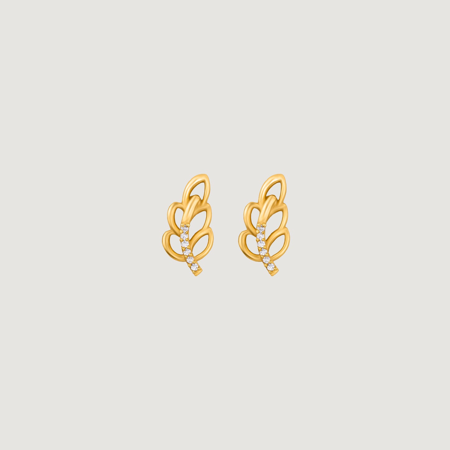 pair of golden earrings with a single diamond