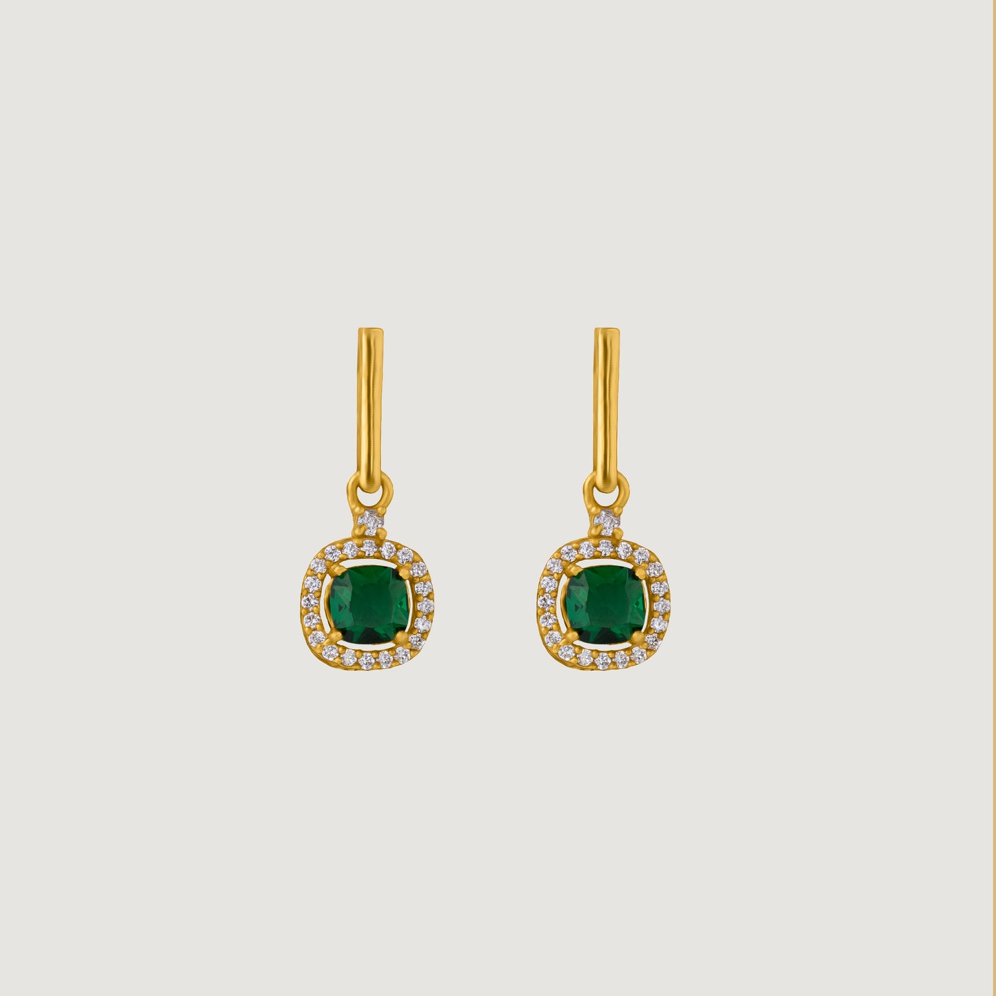 pair of earrings with a ruby stone and diamonds