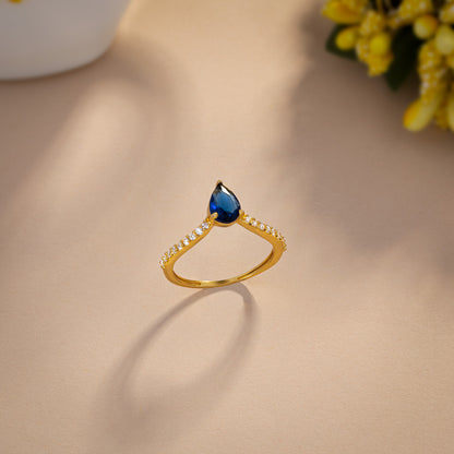 Golden Ring with a Blue Sapphire and Diamonds