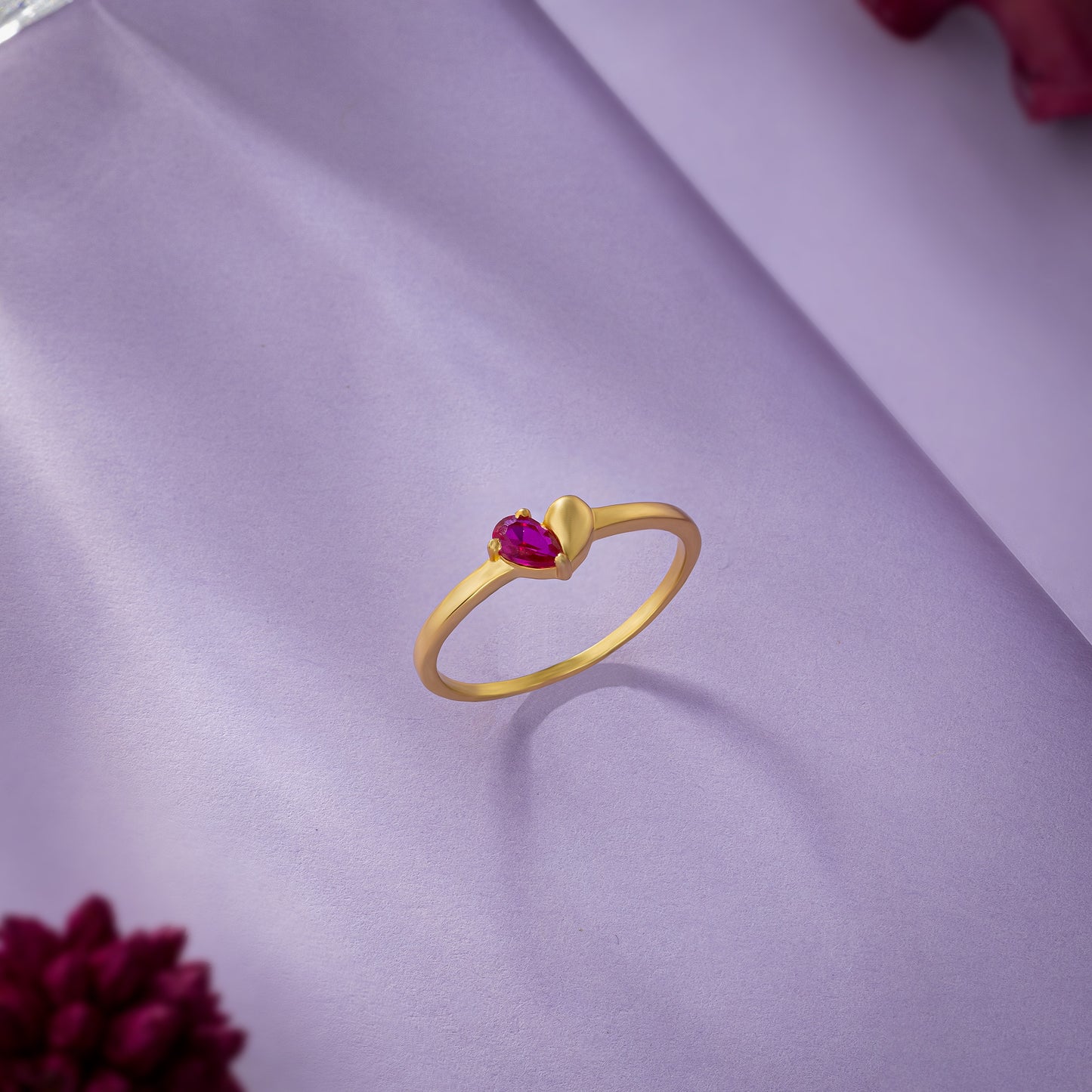 golden ring with a ruby stone