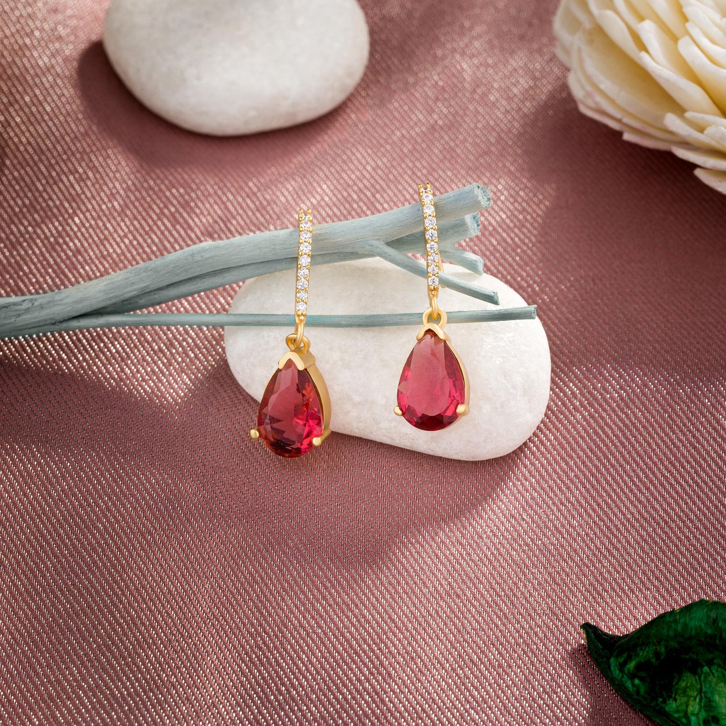 pair of earrings with stones