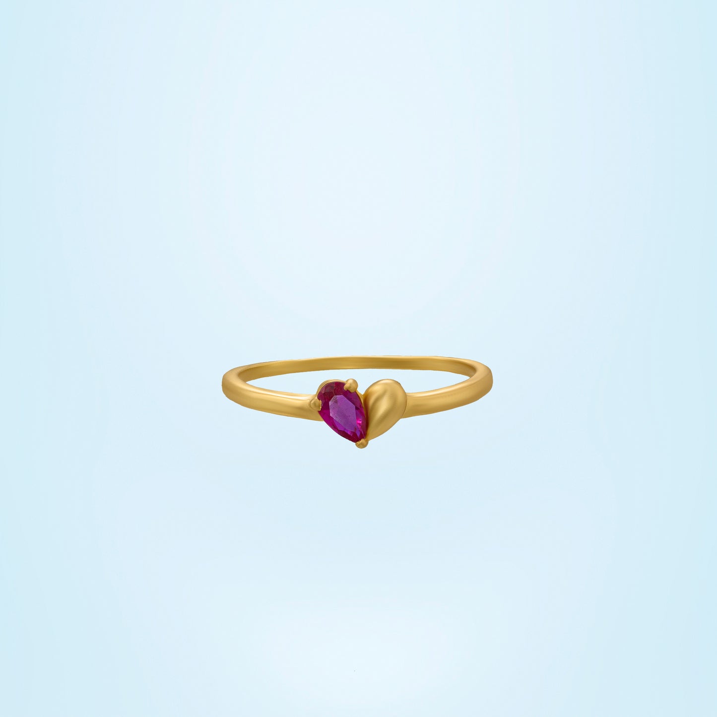 golden ring with a ruby stone