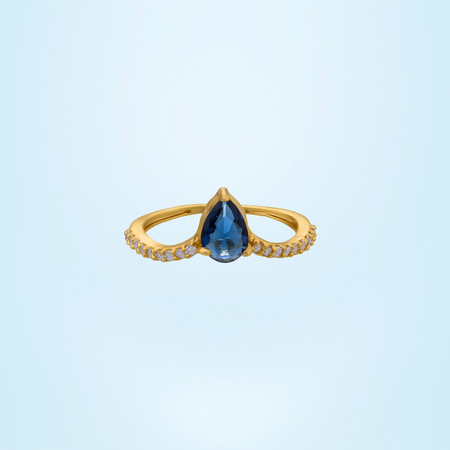 golden ring with a blue sapphire and diamonds