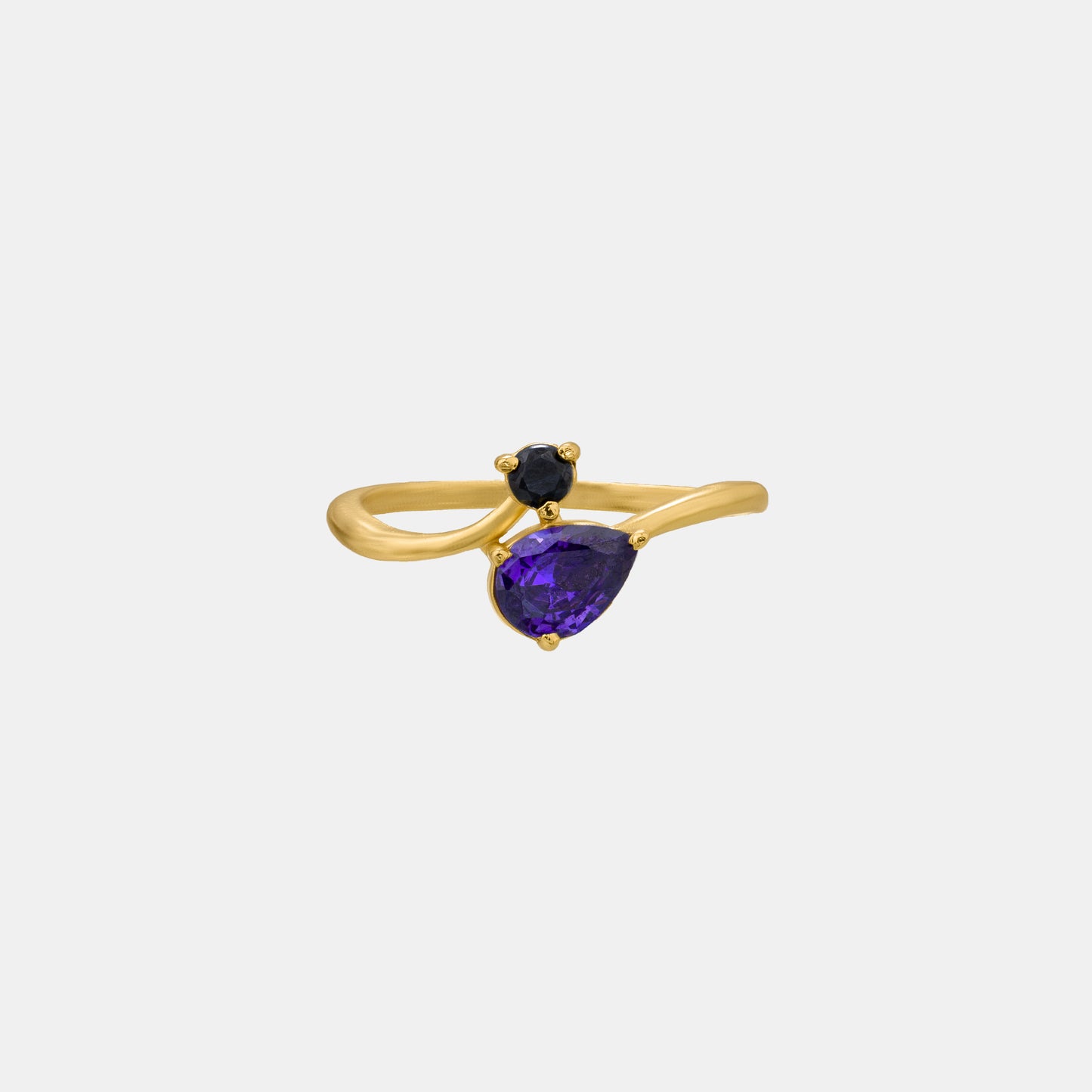 golden ring with a trillion cut sapphire stone