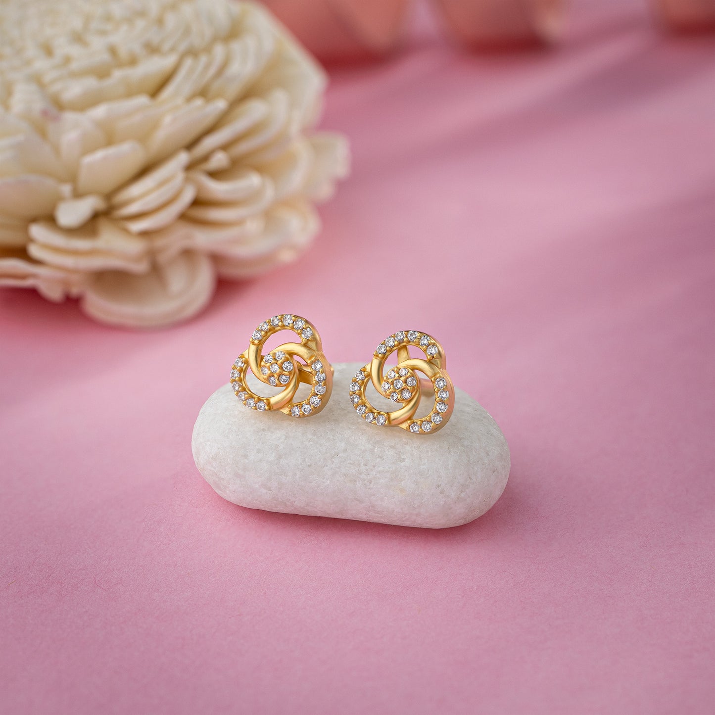 pair of golden and diamond earrings