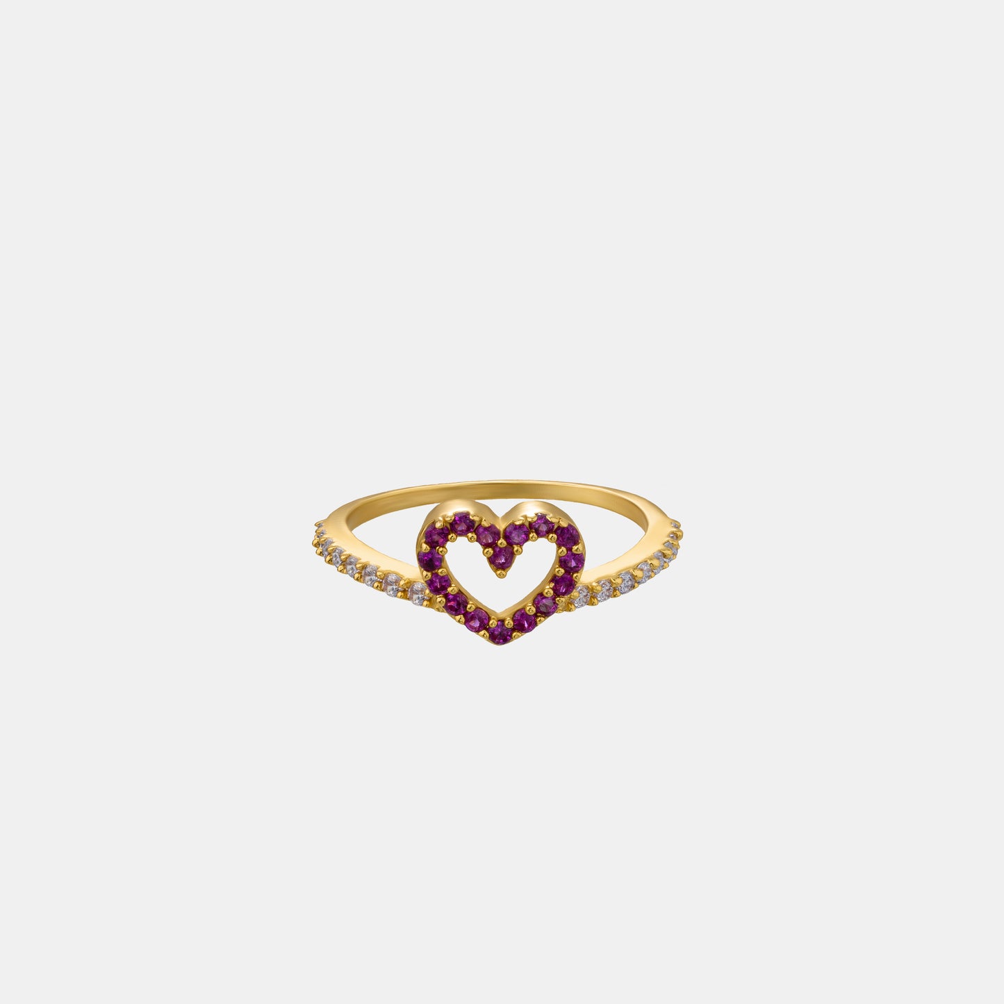 golden ring with a heart shaped ruby stone