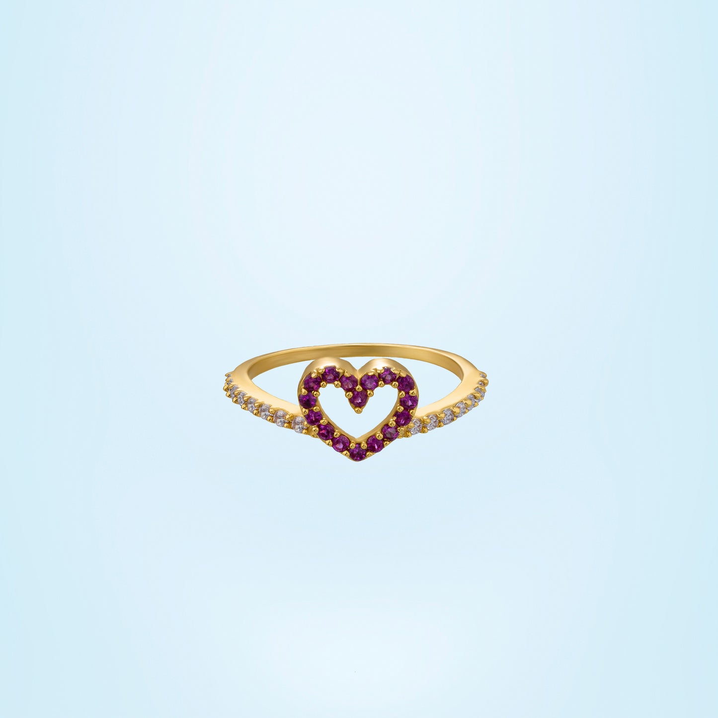 golden ring with a heart shaped ruby stone