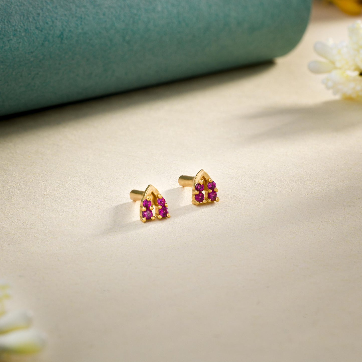 pair of golden earrings with diamonds