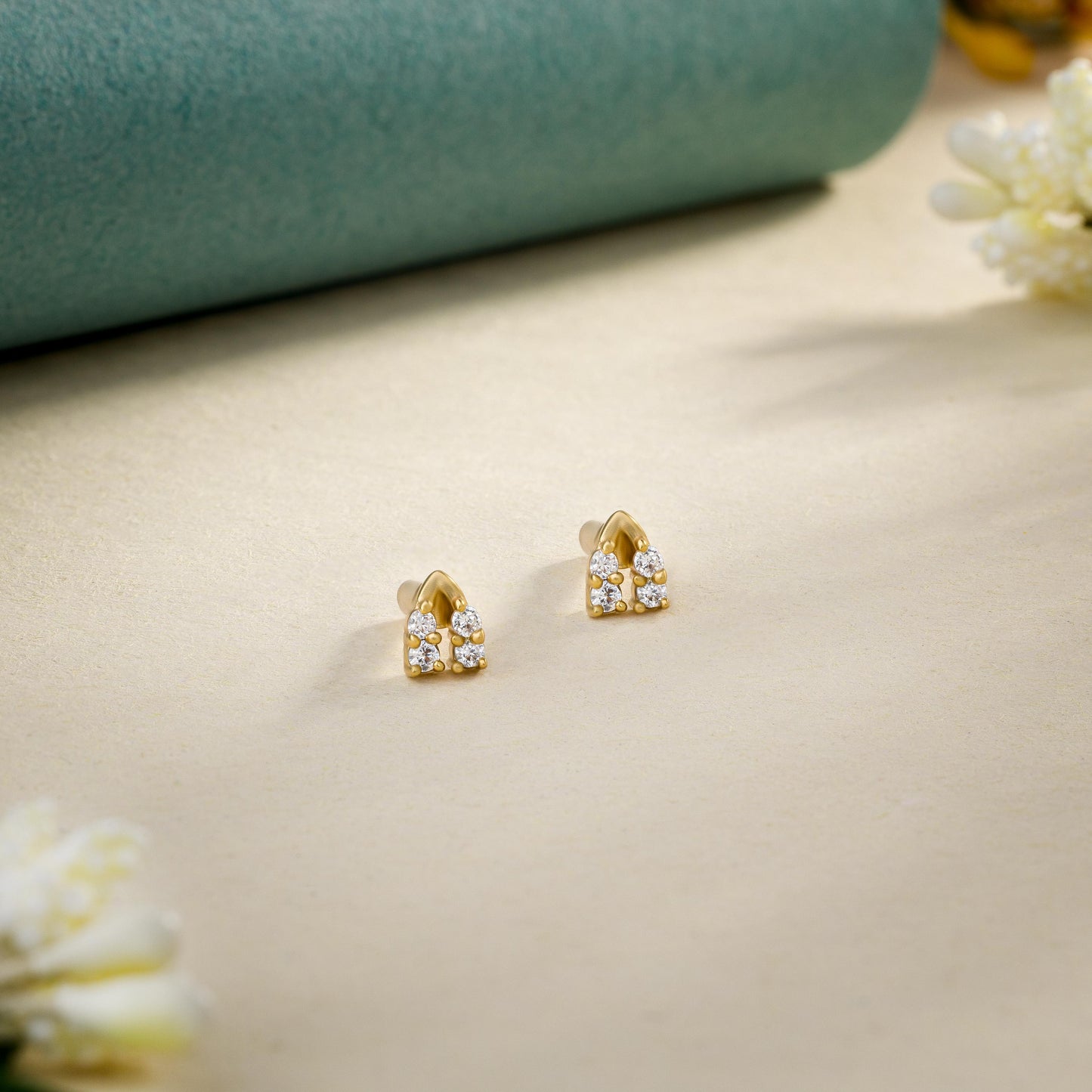 pair of golden earrings with diamonds