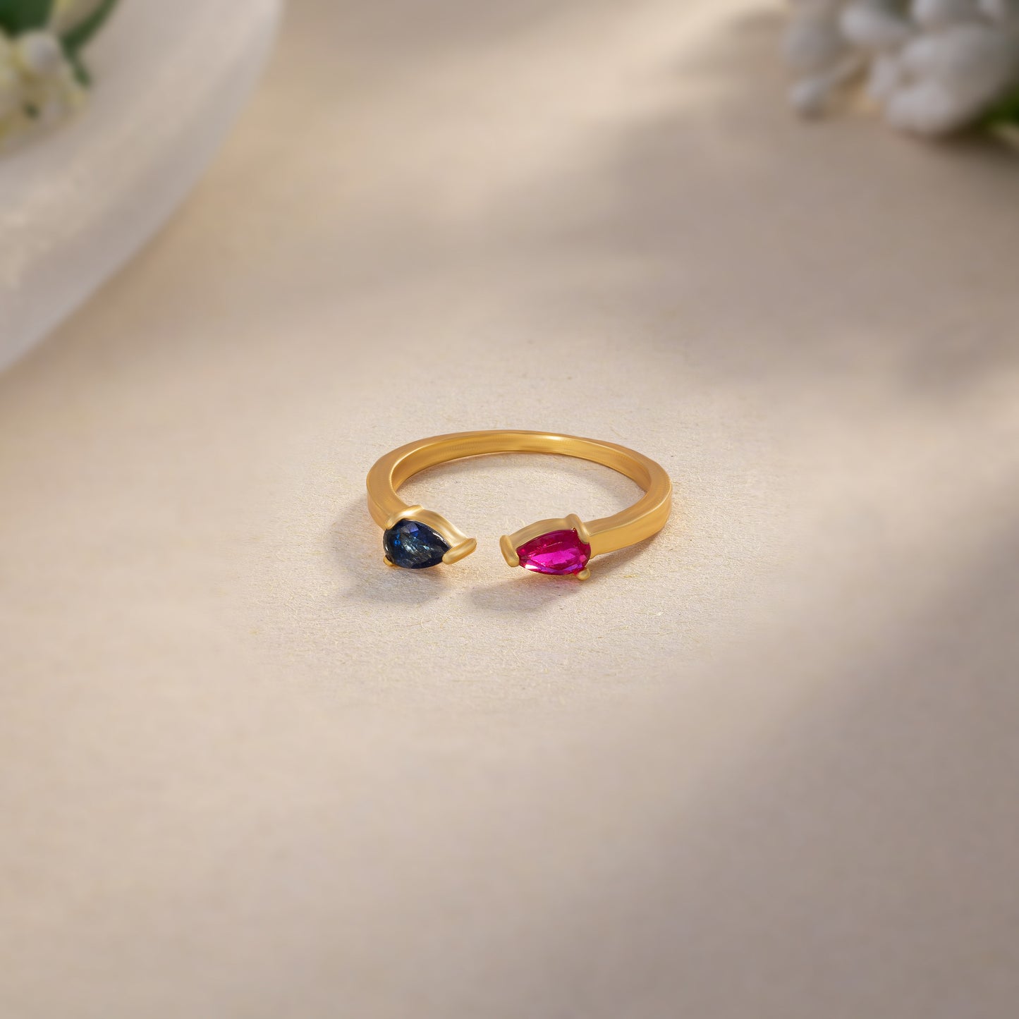 golden ring with a stone and a diamond