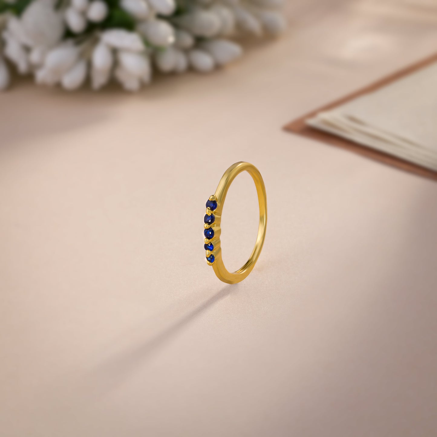 golden ring with blue sapphire stones