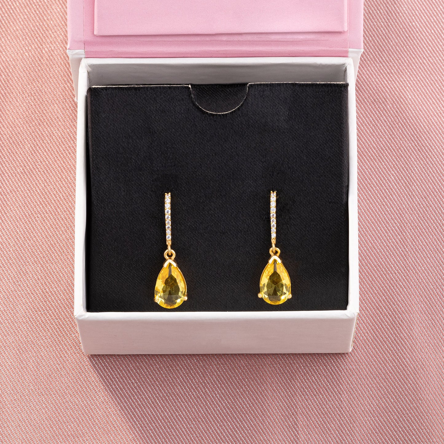 pair of earrings with stones