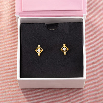 Pair of Golden Earrings with a Diamond