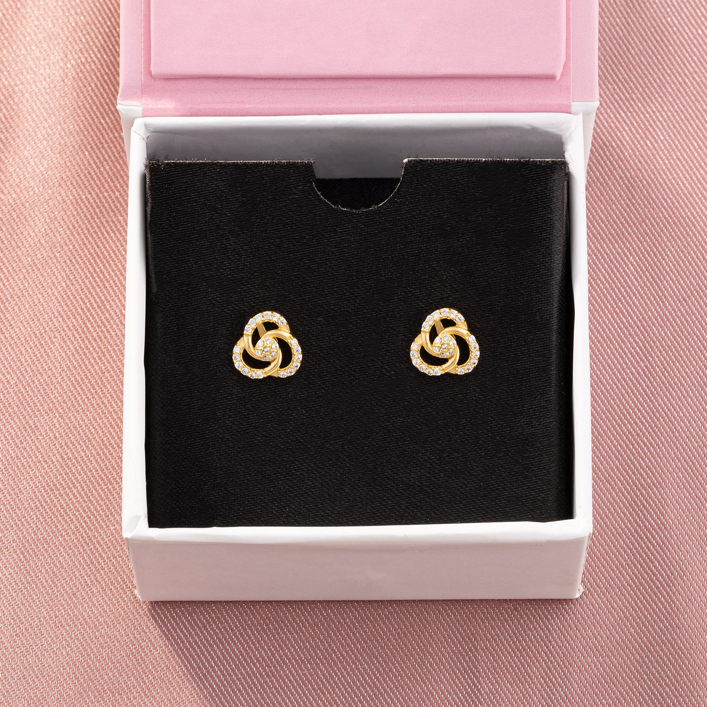 pair of golden and diamond earrings