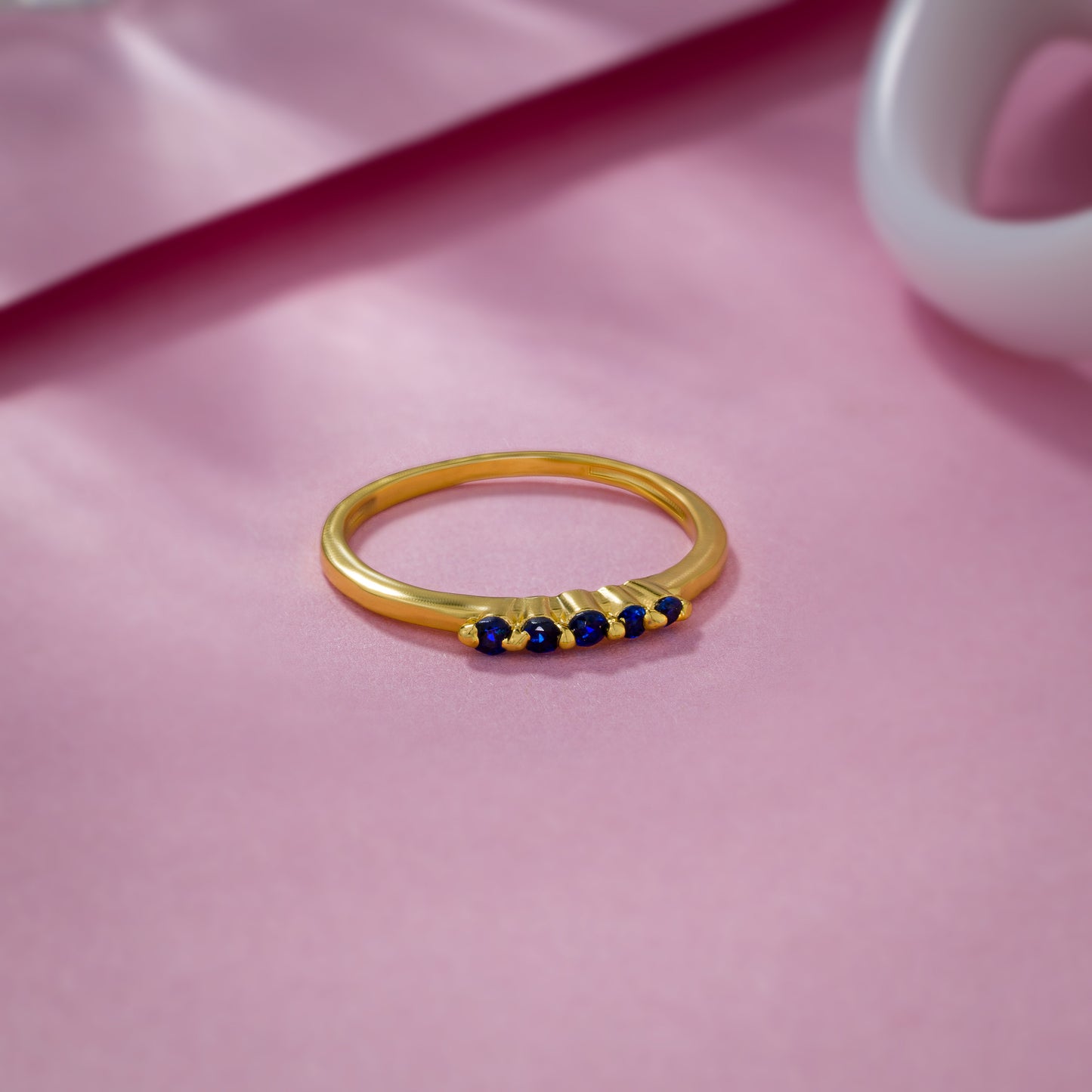 golden ring with blue sapphire stones