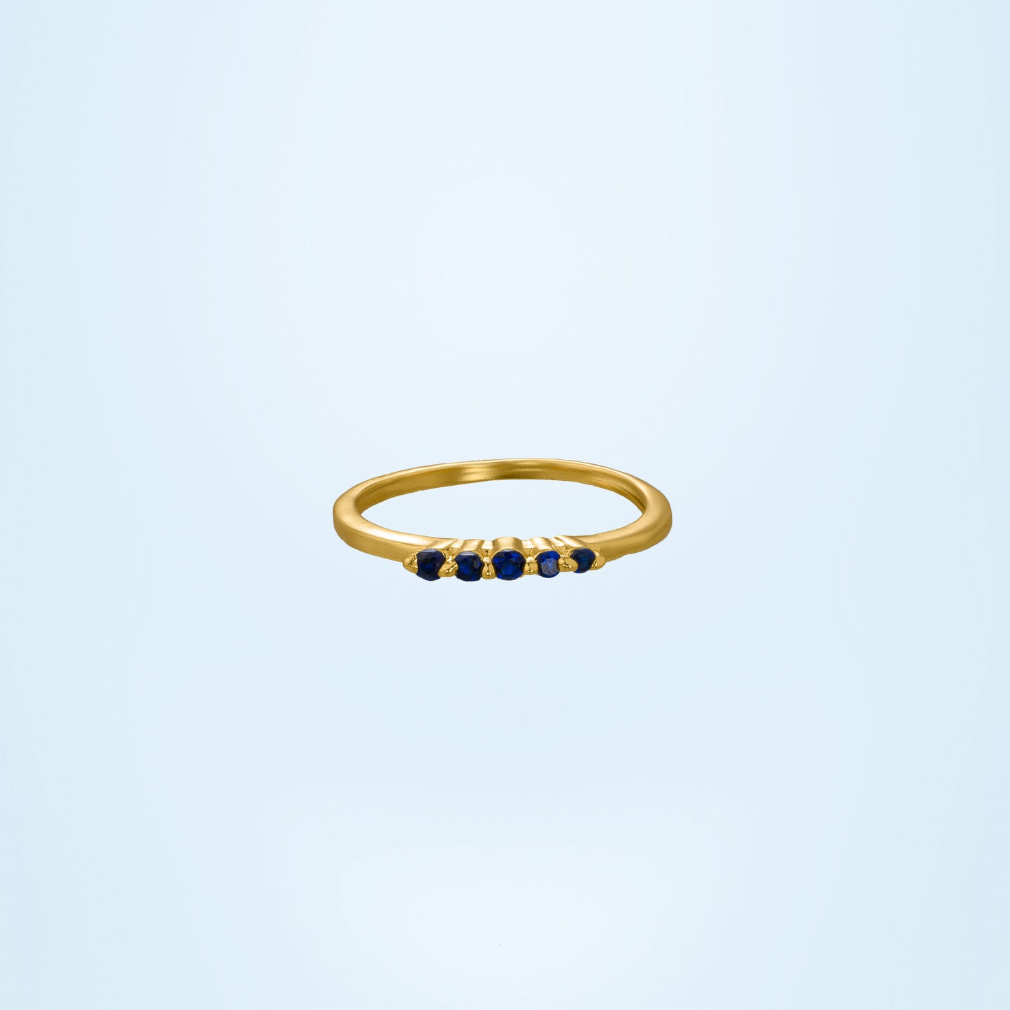 golden ring with blue sapphire stones