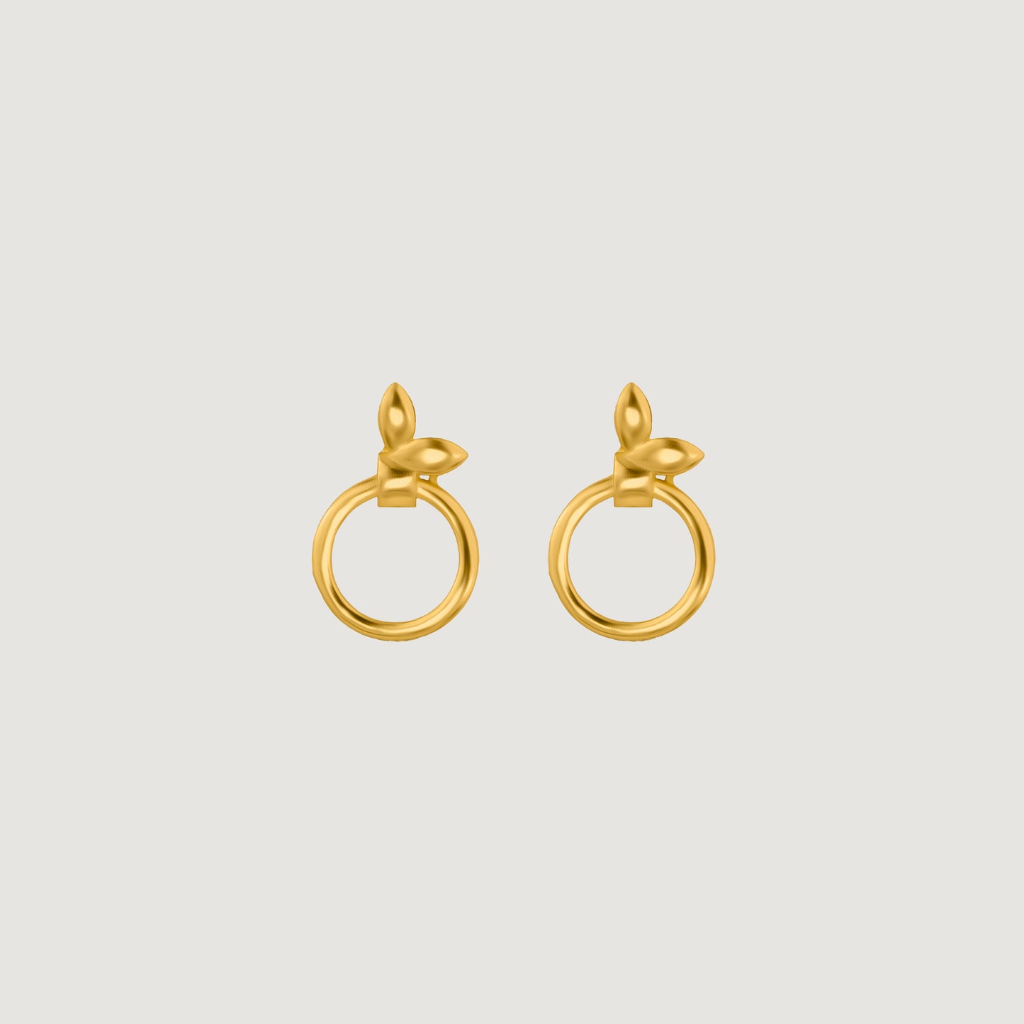 pair of golden earrings with a flower