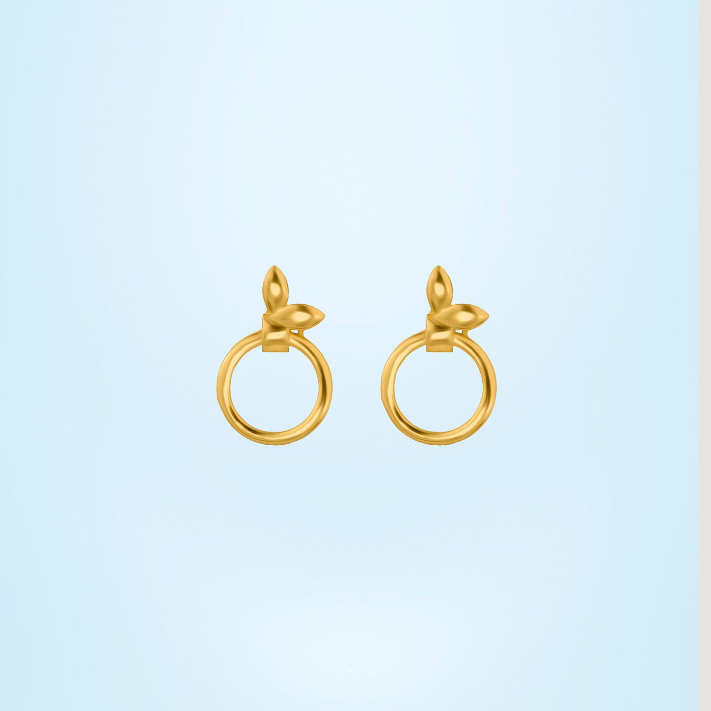 pair of golden earrings with a flower