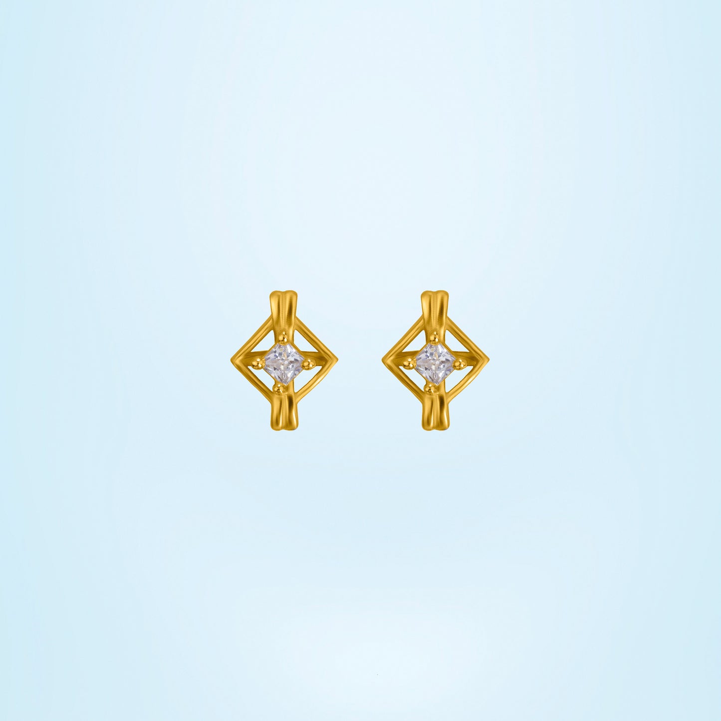 pair of golden earrings with a diamond