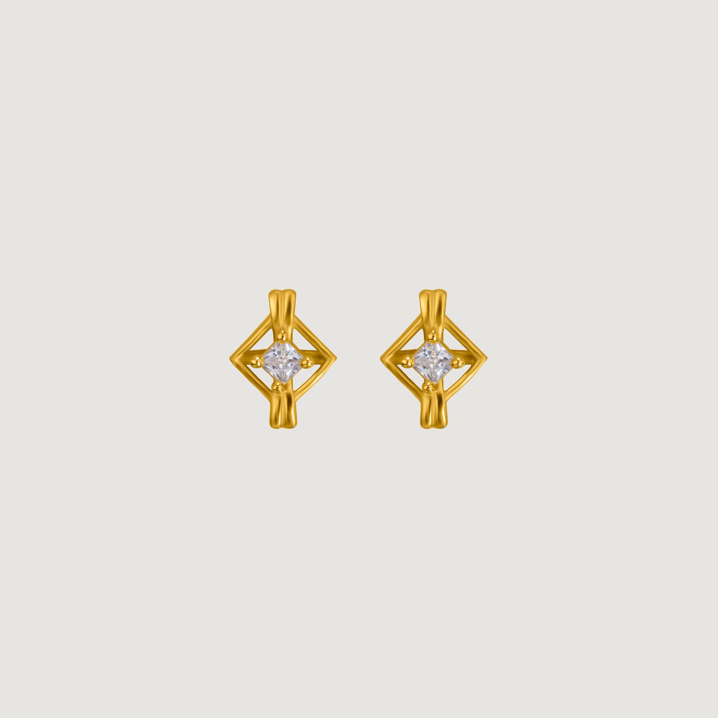 pair of golden earrings with a diamond