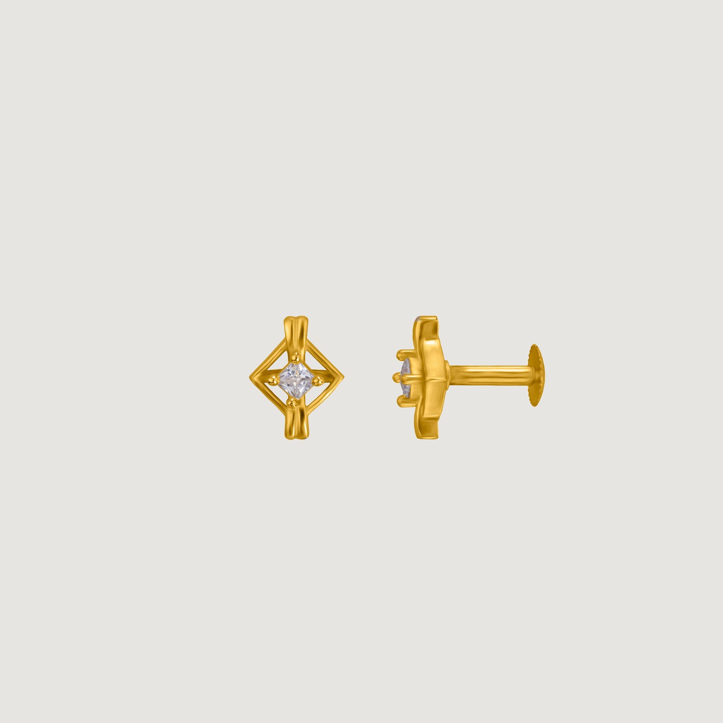 pair of golden earrings with a diamond