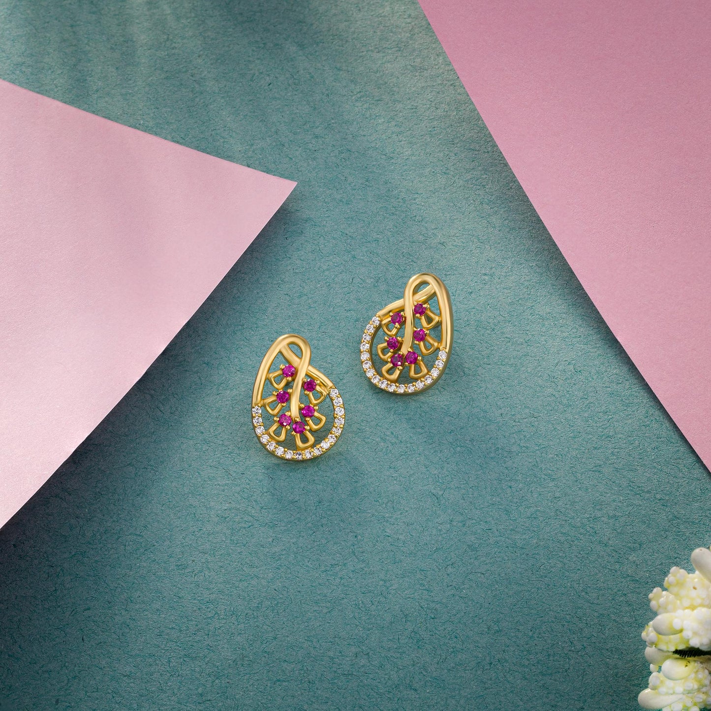 pair of golden earrings with ruby and diamonds