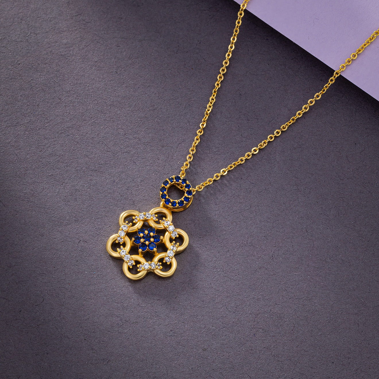 golden necklace with sapphire stones