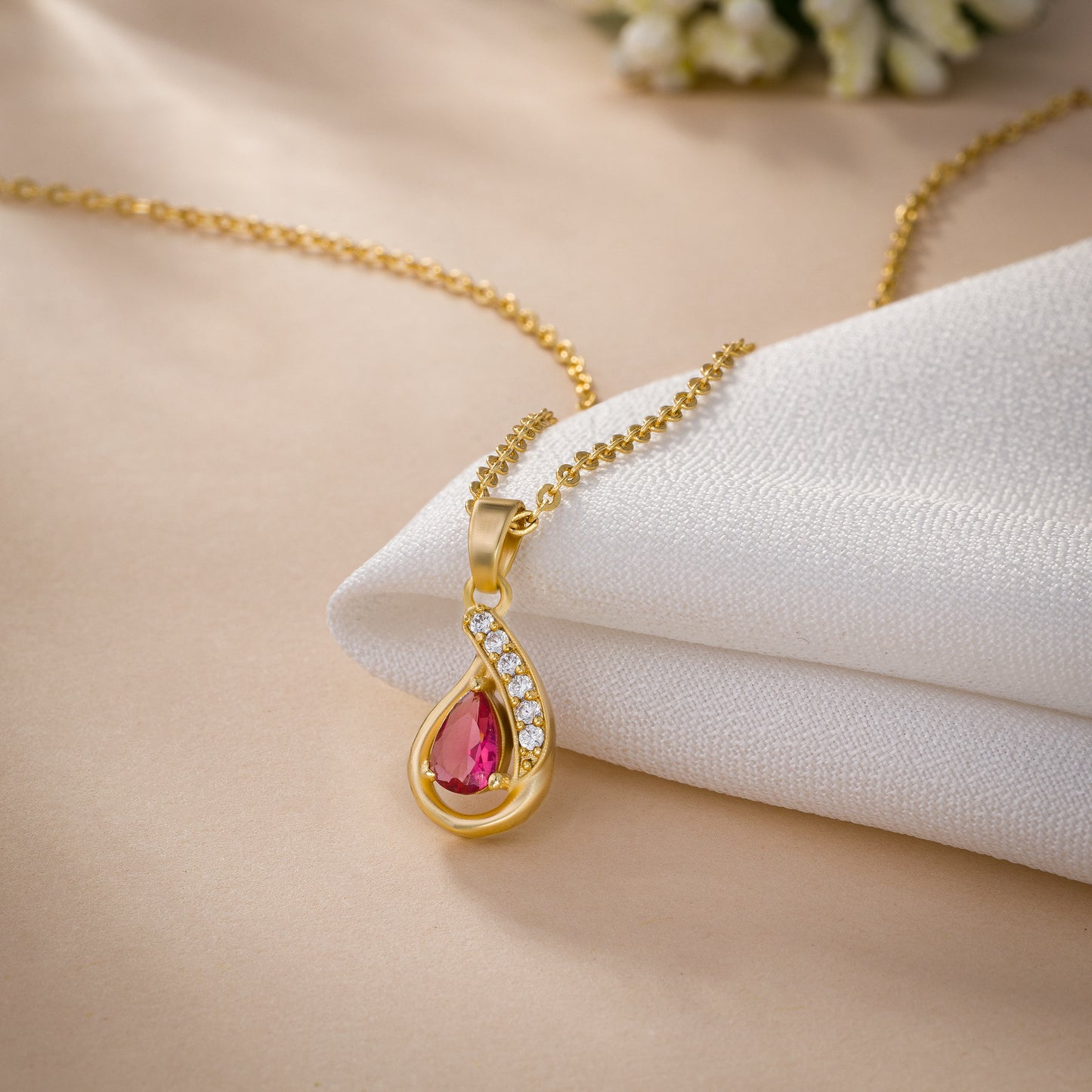 golden necklace with a stone pendant