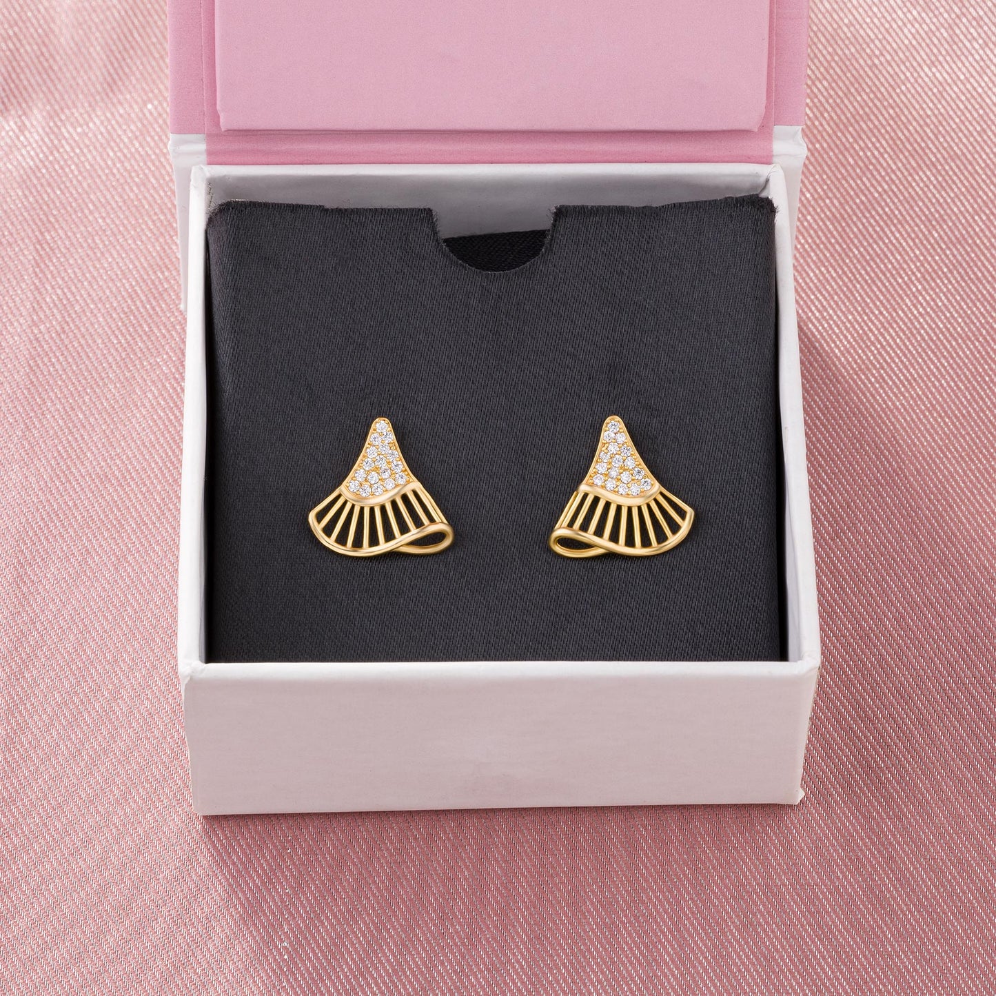 pair of golden earrings with diamonds