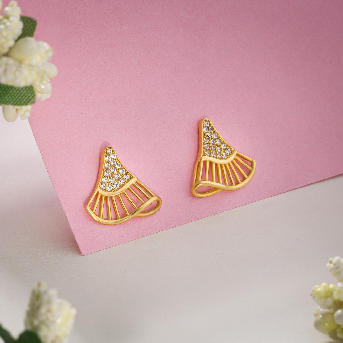 pair of golden earrings with diamonds