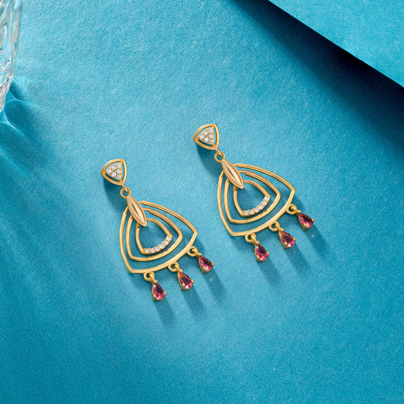 pair of golden earrings with diamonds