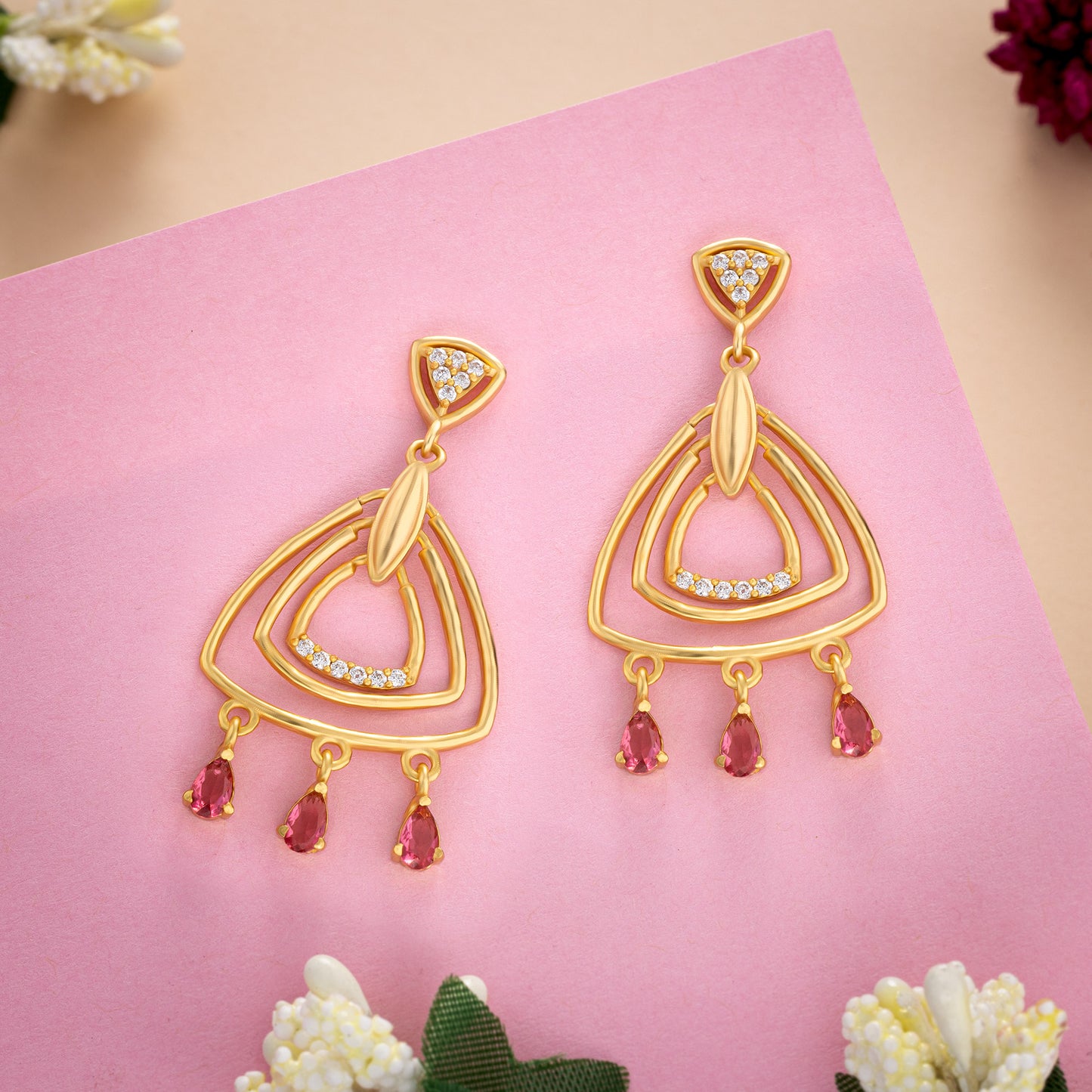 pair of golden earrings with diamonds