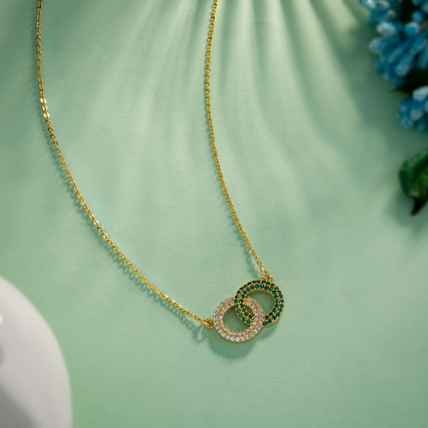 golden necklace with a diamond pendant